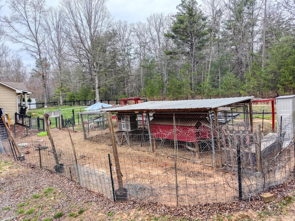 109 Hefner Road Blairsville, GA 30512 - Photo 46 of 48 a view of a chairs and table in the backyard