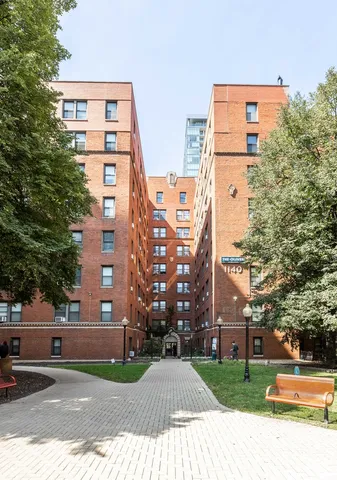 front view of a building with a yard