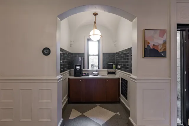 a view of living room with granite countertop furniture and fireplace