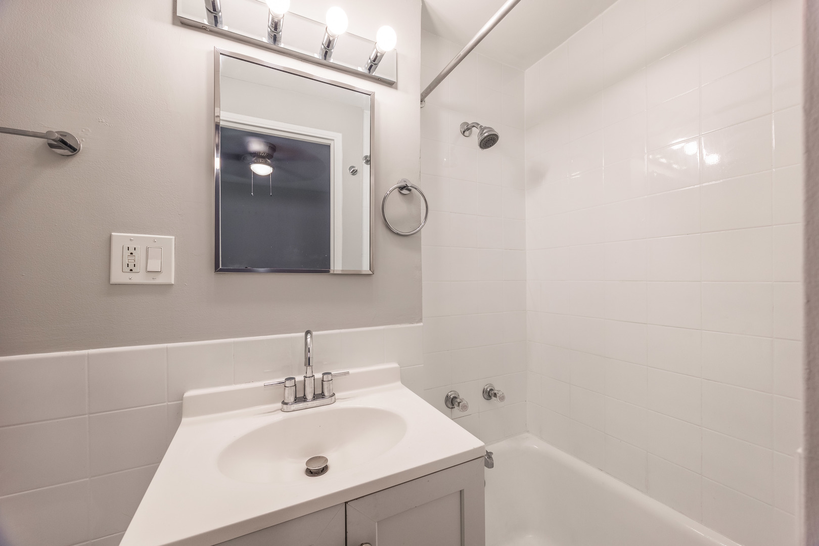 1140 North LaSalle Drive, Unit 203 Chicago, IL 60610 - Photo 10 of 25 a bathroom with a sink and a mirror