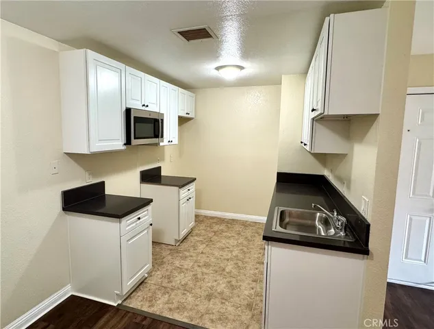 a kitchen with a stove and a microwave