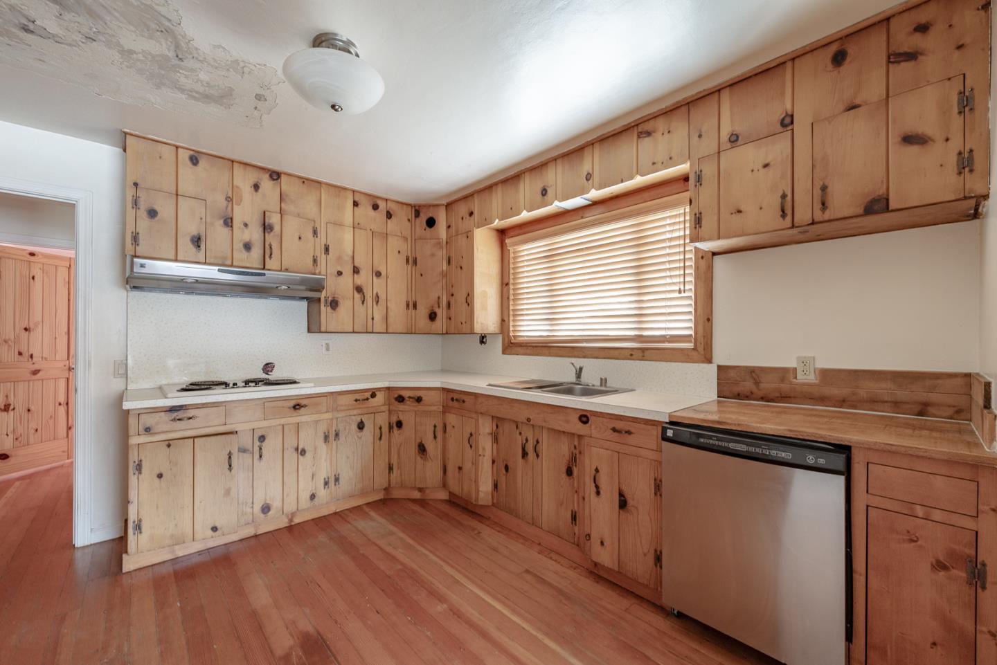 137 Whiting Road Watsonville, CA 95076 - Photo 13 of 52 a kitchen with granite countertop white cabinets and white appliances