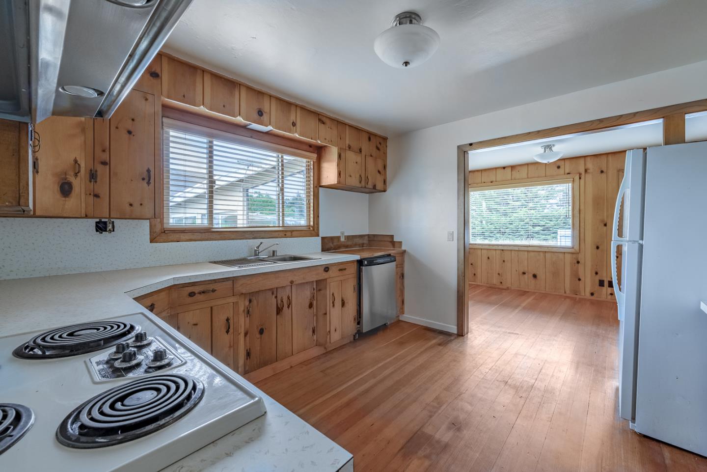 137 Whiting Road Watsonville, CA 95076 - Photo 15 of 52 a kitchen with a stove and wooden floor