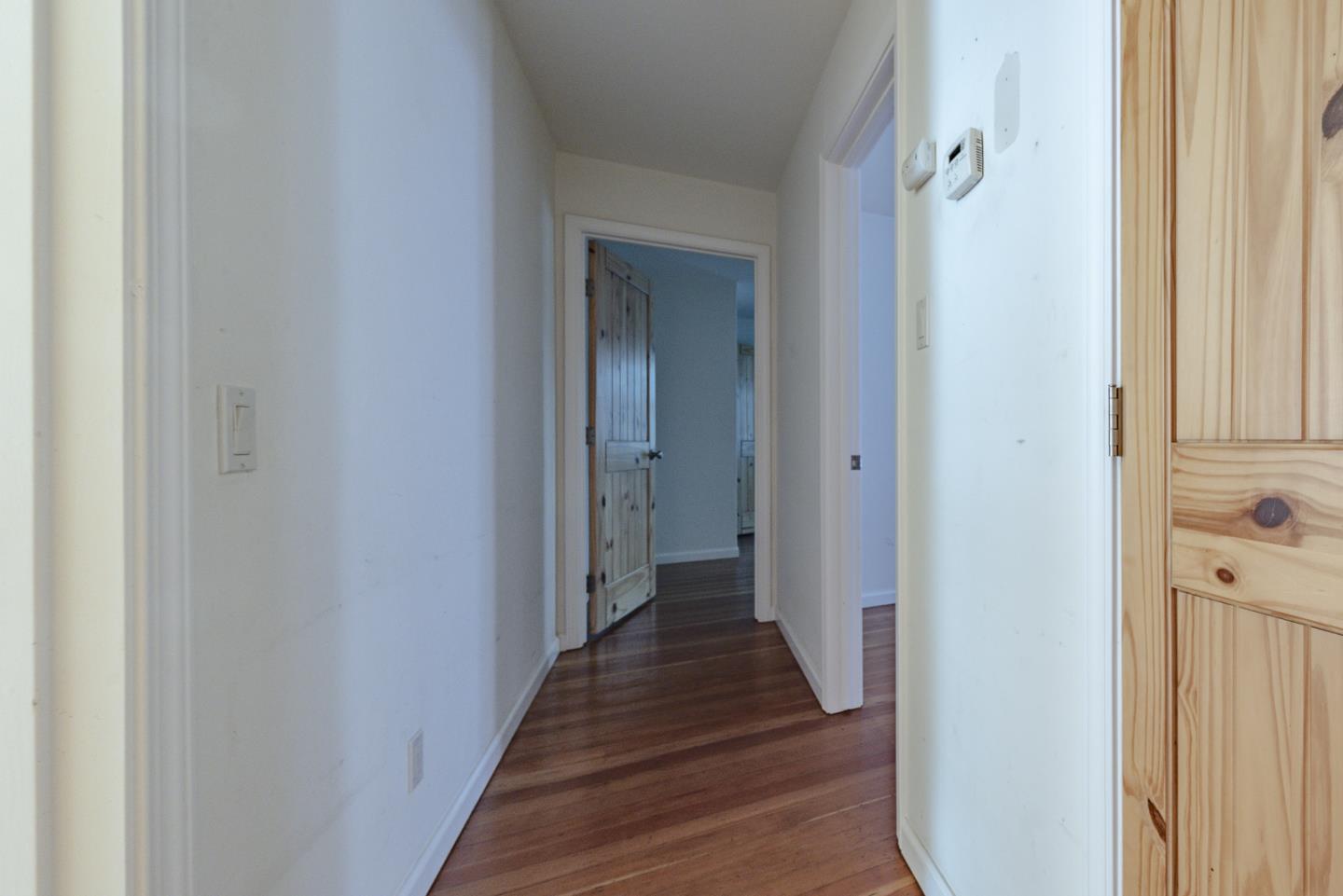 137 Whiting Road Watsonville, CA 95076 - Photo 16 of 52 a view of a hallway with wooden floor