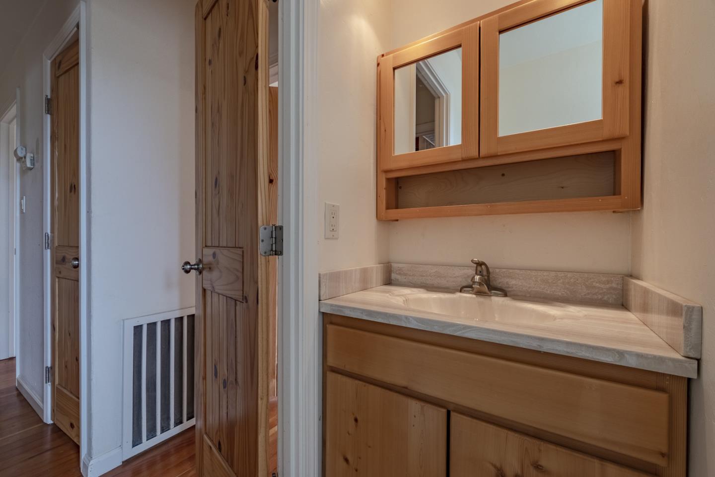 137 Whiting Road Watsonville, CA 95076 - Photo 23 of 52 a bathroom with a sink and a mirror