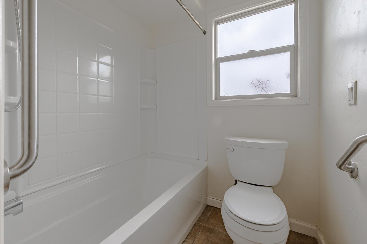137 Whiting Road Watsonville, CA 95076 - Photo 24 of 52 a white toilet sitting next to a bath tub