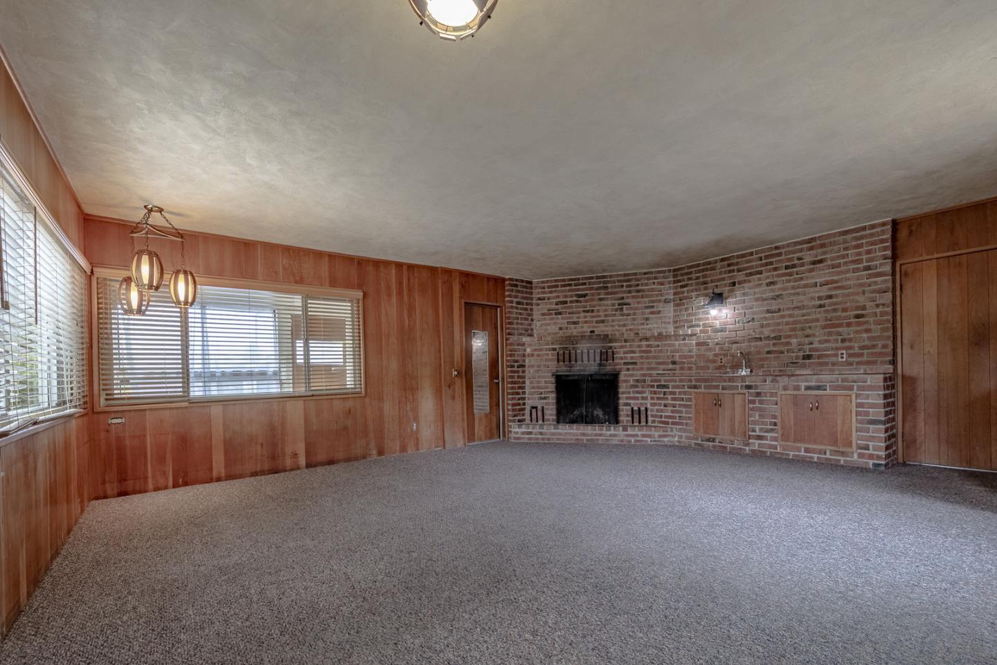 137 Whiting Road Watsonville, CA 95076 - Photo 28 of 52 an empty room with fireplace and windows