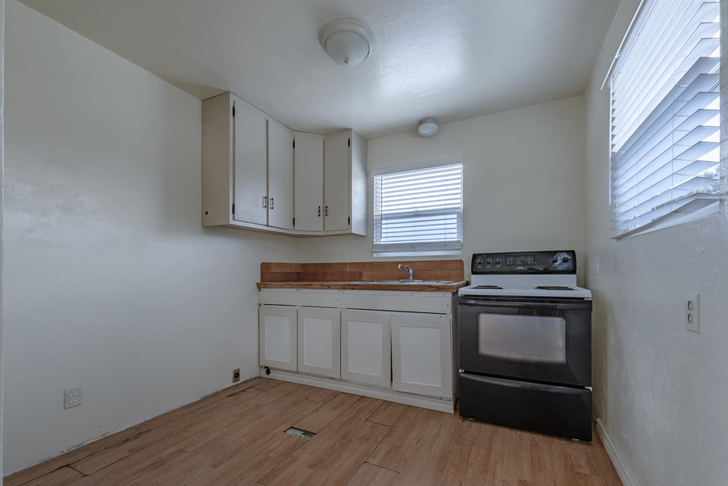 137 Whiting Road Watsonville, CA 95076 - Photo 35 of 52 a kitchen with granite countertop cabinets stainless steel appliances and a window