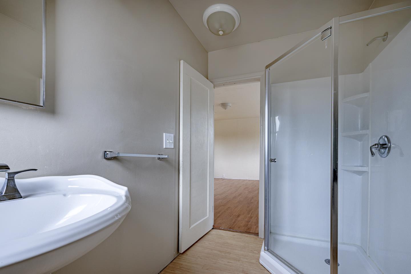 137 Whiting Road Watsonville, CA 95076 - Photo 37 of 52 a bathroom with a sink and shower