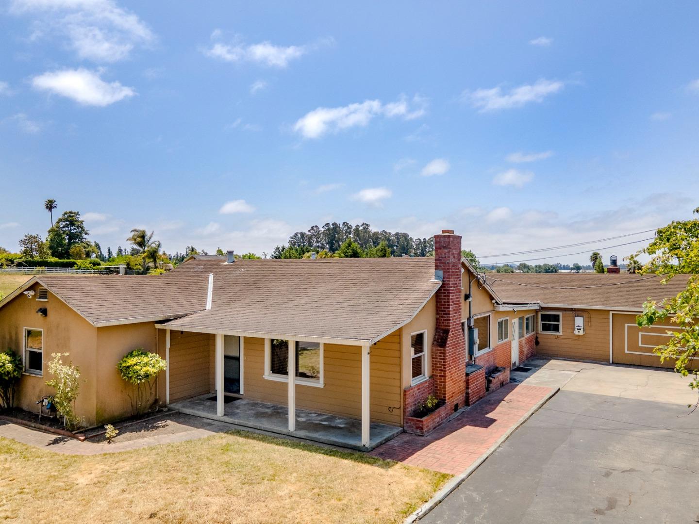 137 Whiting Road Watsonville, CA 95076 - Photo 5 of 52 a front view of a house with a yard