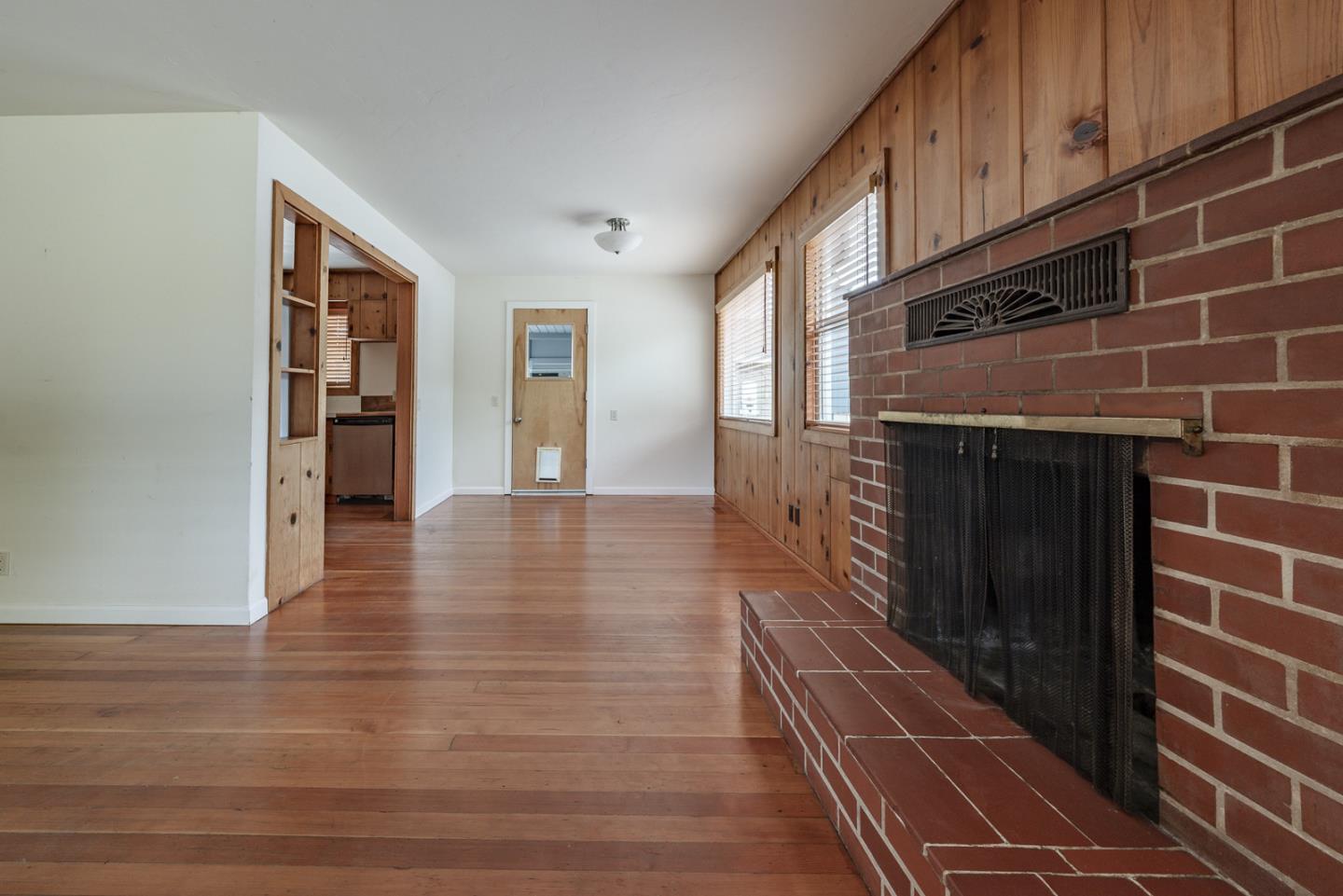 137 Whiting Road Watsonville, CA 95076 - Photo 10 of 52 a hallway with wooden floor and windows