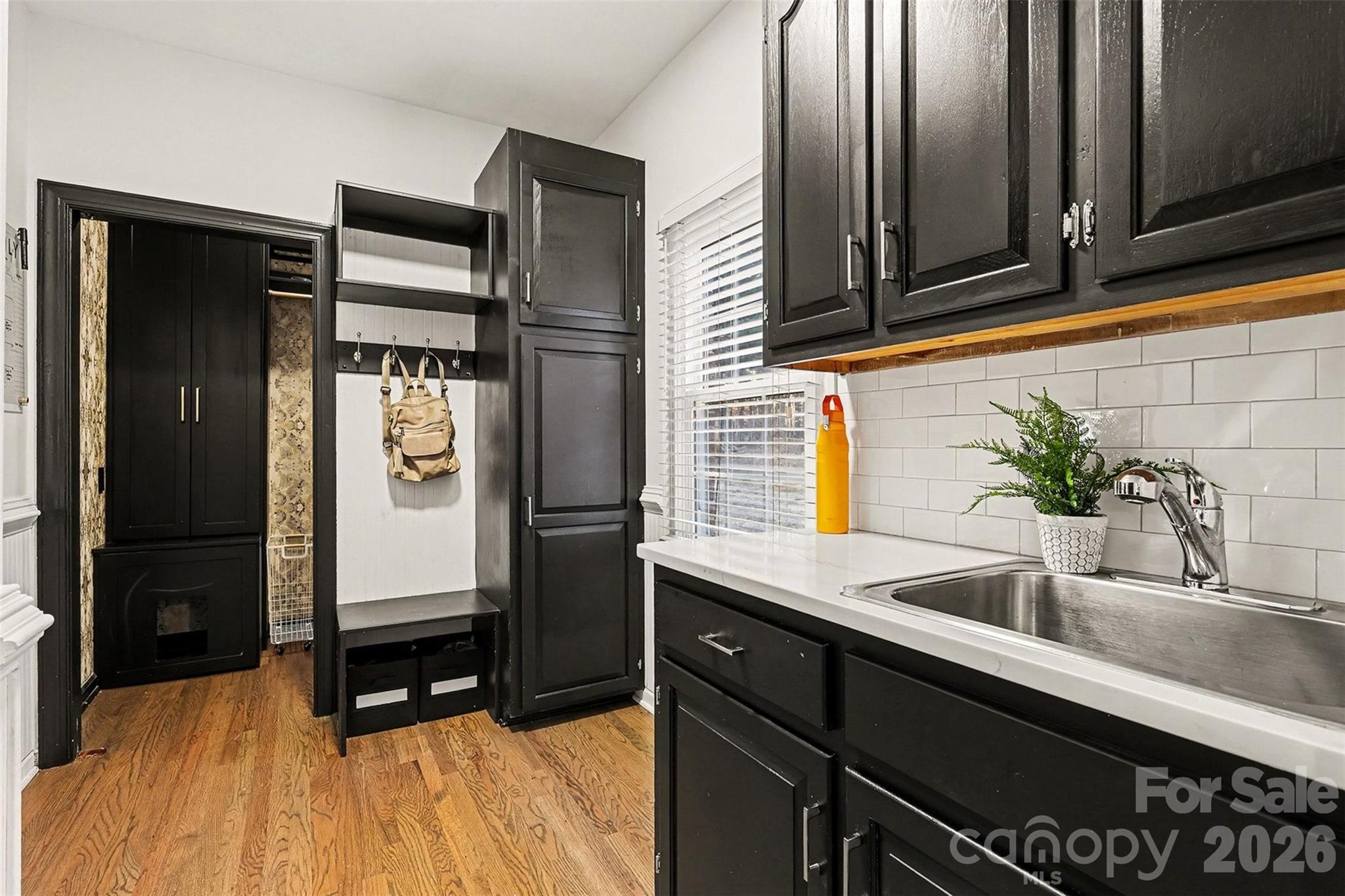 14320 Youngblood Road Charlotte, NC 28278 - Photo 11 of 41 a kitchen with a sink and refrigerator