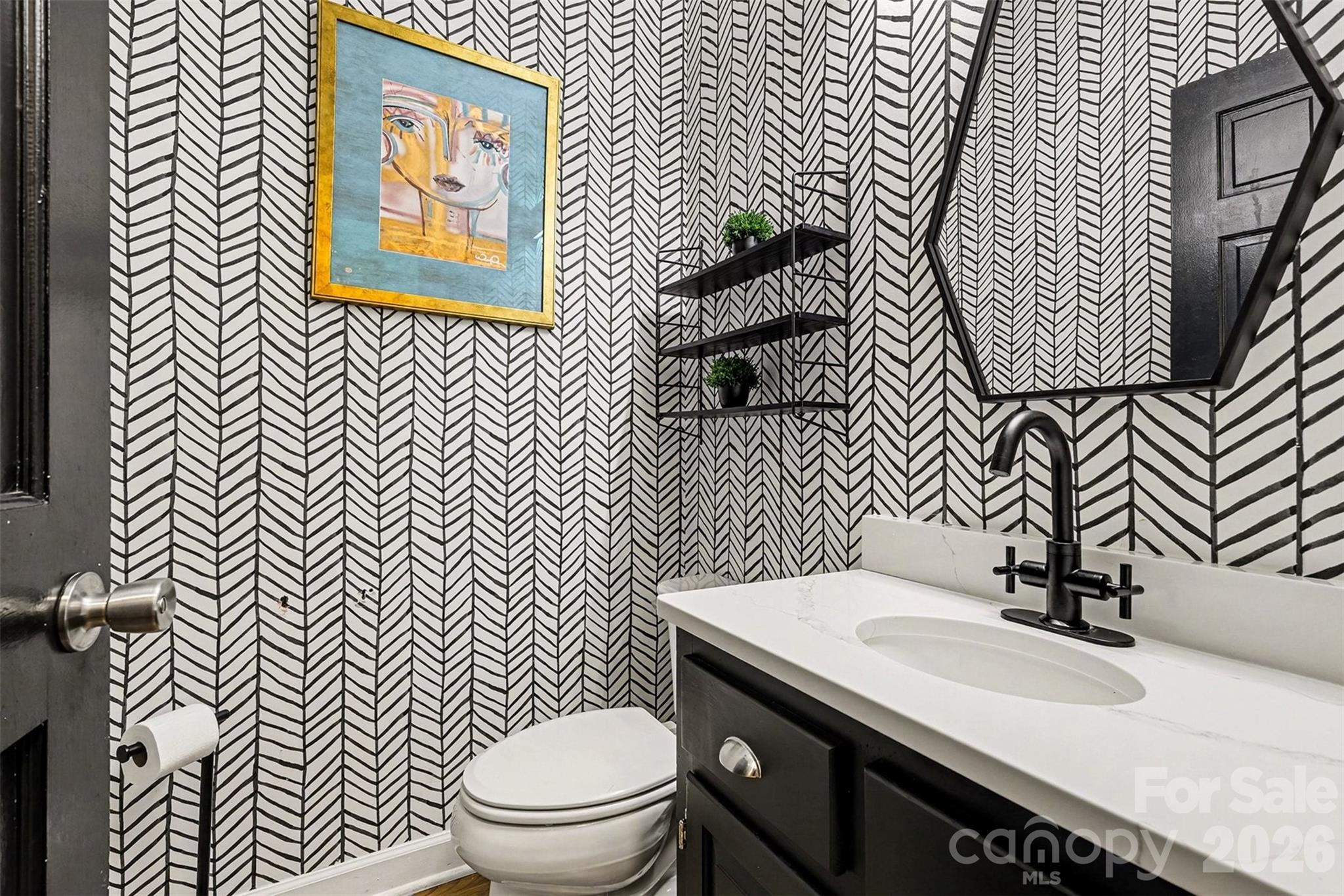 14320 Youngblood Road Charlotte, NC 28278 - Photo 12 of 41 a bathroom with a sink a toilet and mirror