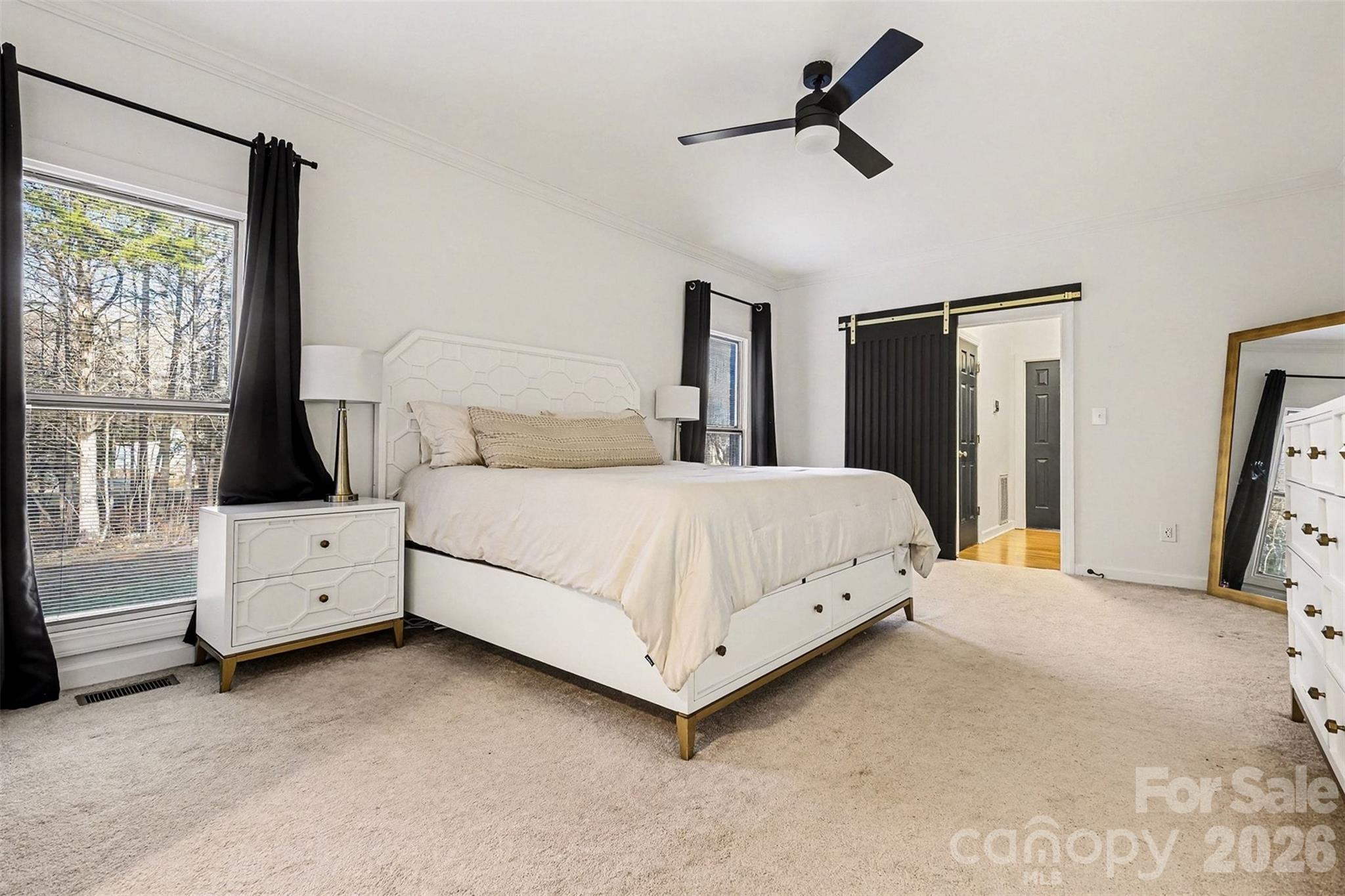 14320 Youngblood Road Charlotte, NC 28278 - Photo 17 of 41 a bedroom with a white bed and white walls