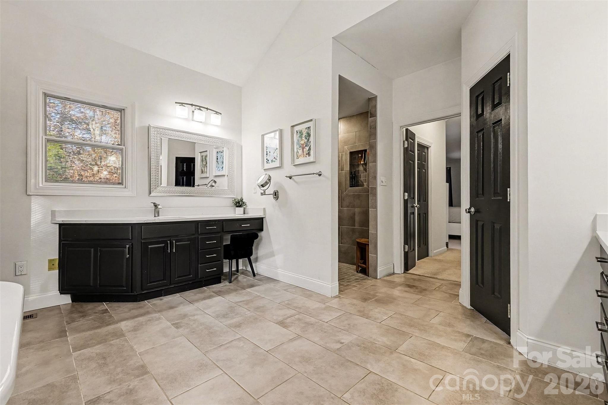 14320 Youngblood Road Charlotte, NC 28278 - Photo 18 of 41 a living room with a couch and a flat screen tv