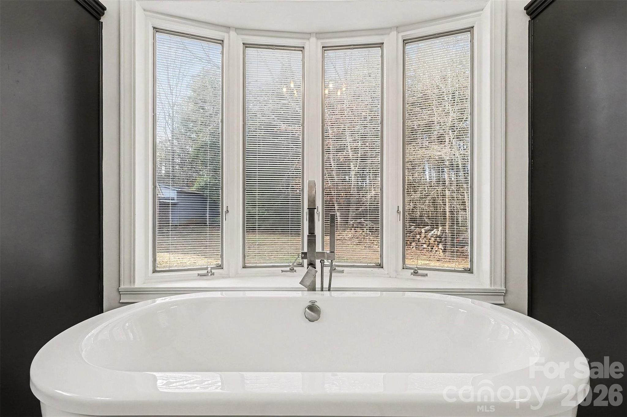 14320 Youngblood Road Charlotte, NC 28278 - Photo 19 of 41 a white bath tub sitting next to a window