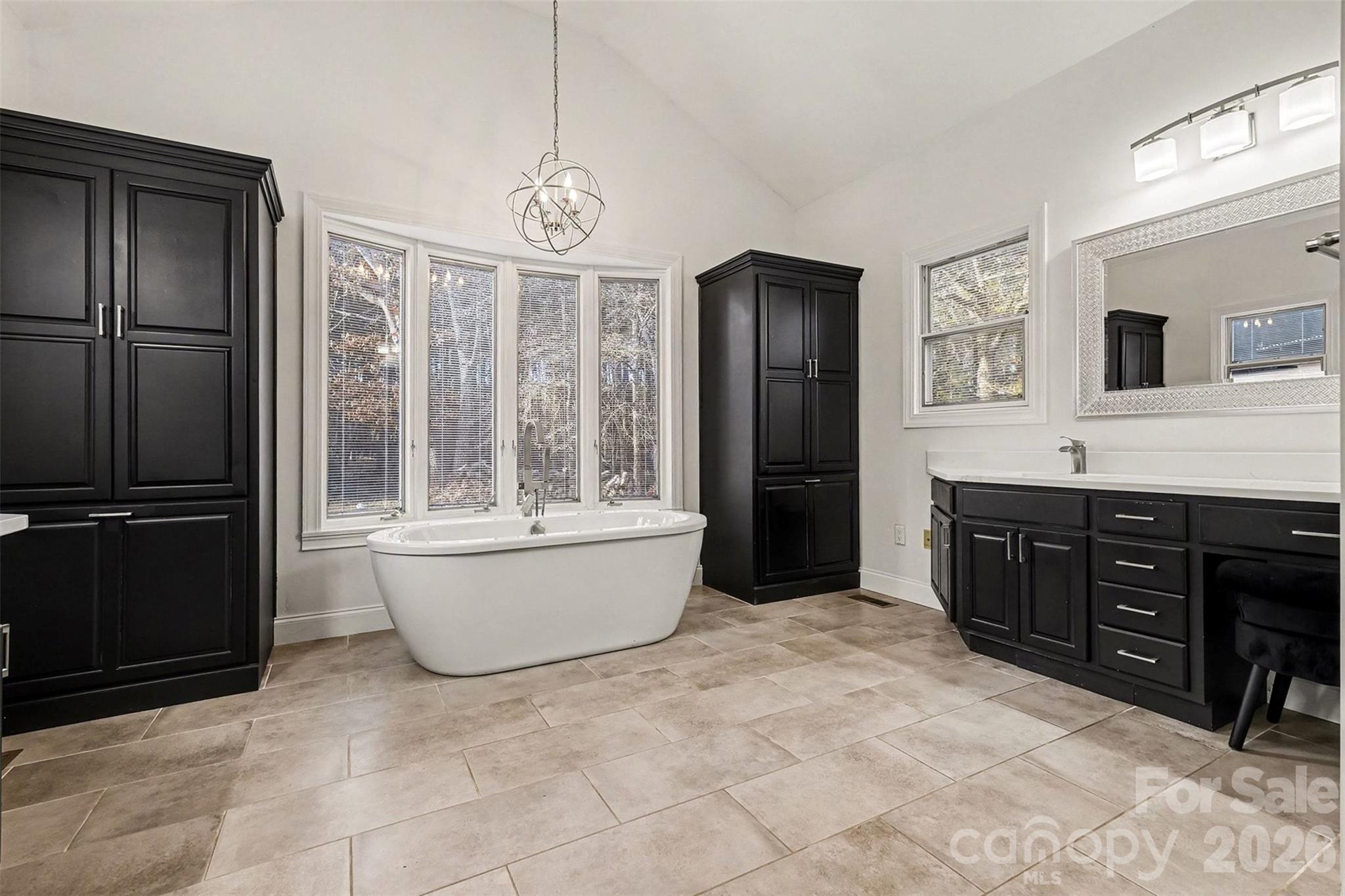 14320 Youngblood Road Charlotte, NC 28278 - Photo 21 of 41 a large spacious bathroom with a tub sink and mirror