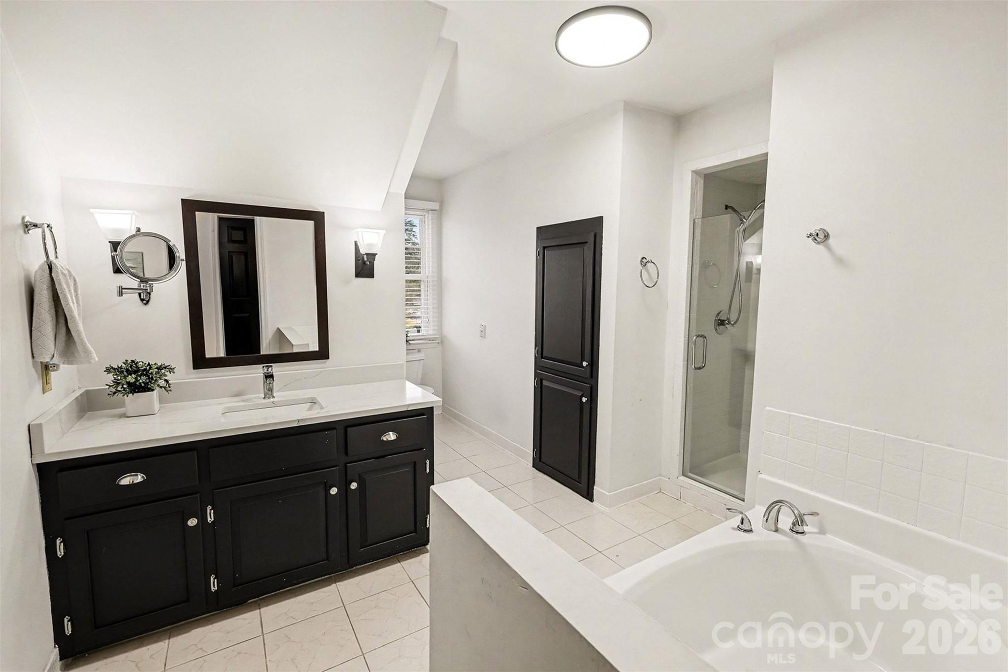 14320 Youngblood Road Charlotte, NC 28278 - Photo 25 of 41 a bathroom with a double vanity sink and mirror