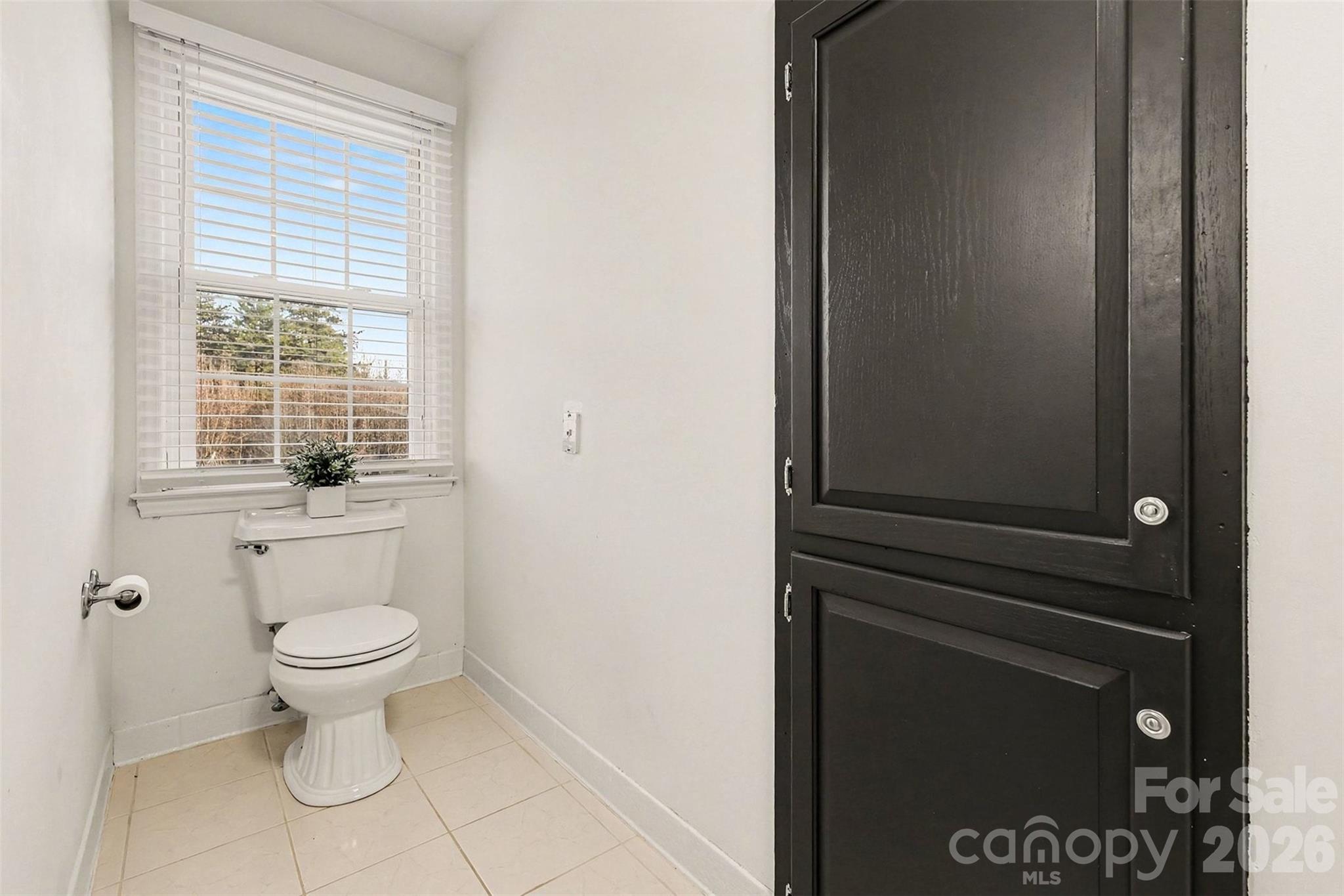 14320 Youngblood Road Charlotte, NC 28278 - Photo 29 of 41 a bathroom with a toilet and a sink
