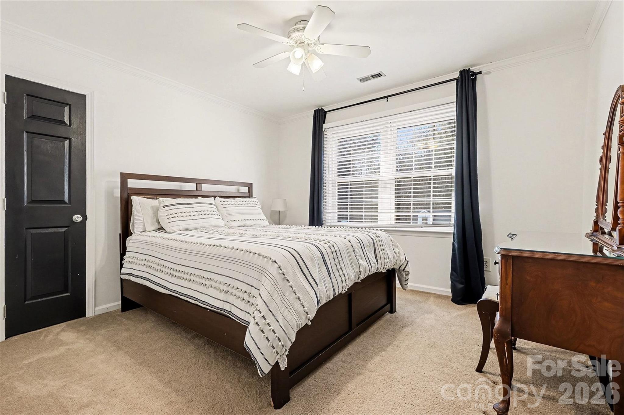 14320 Youngblood Road Charlotte, NC 28278 - Photo 31 of 41 a bedroom with a bed lamp and a window