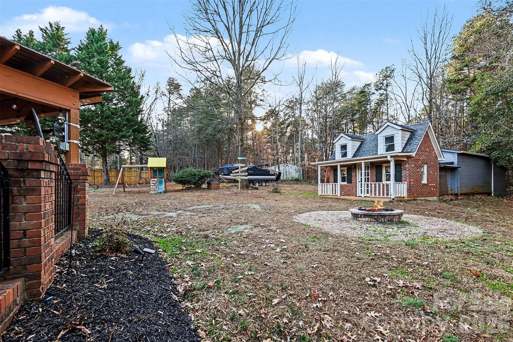 14320 Youngblood Road Charlotte, NC 28278 - Photo 37 of 41 a view of a house with backyard and sitting area