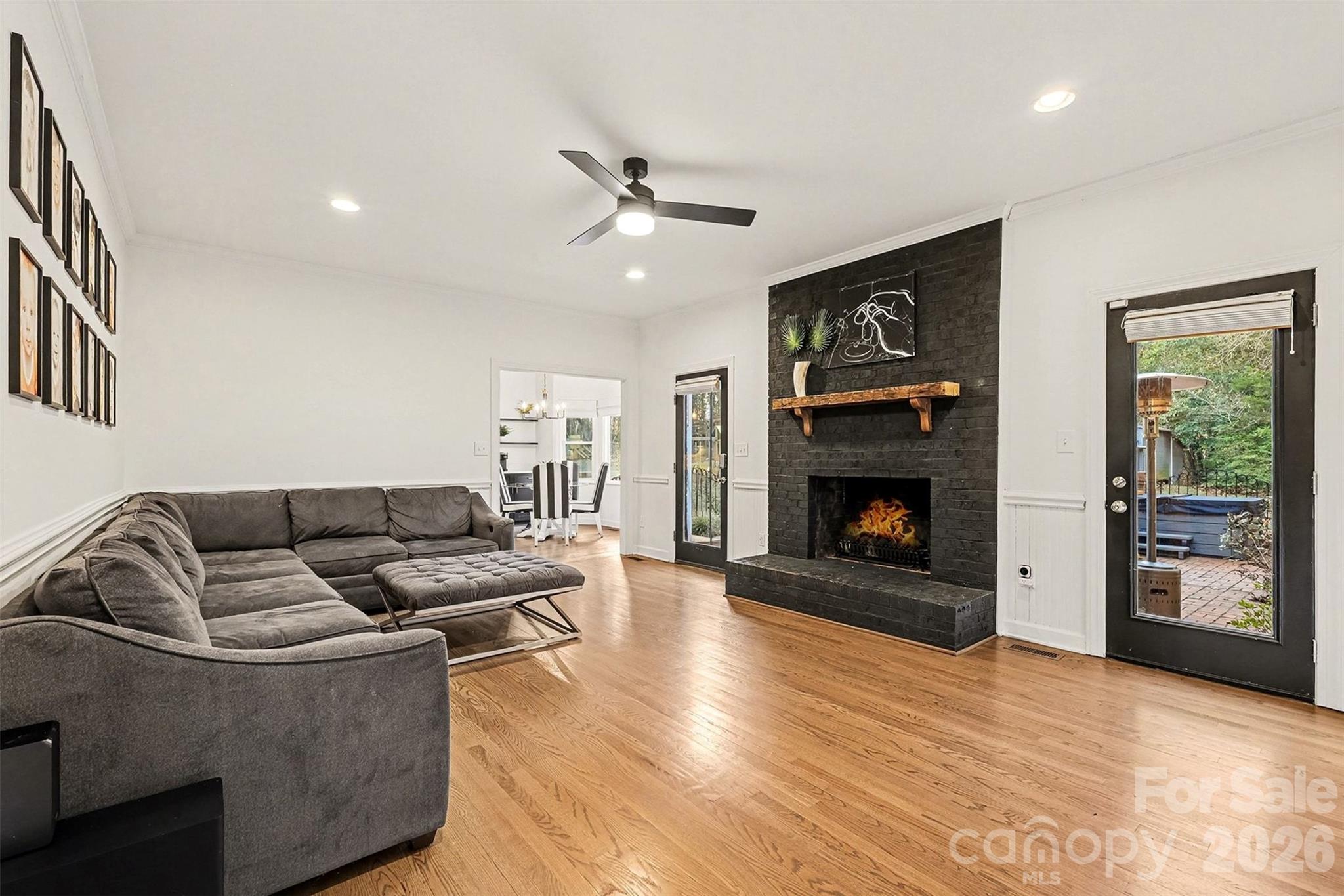 14320 Youngblood Road Charlotte, NC 28278 - Photo 4 of 41 a living room with furniture and a fireplace