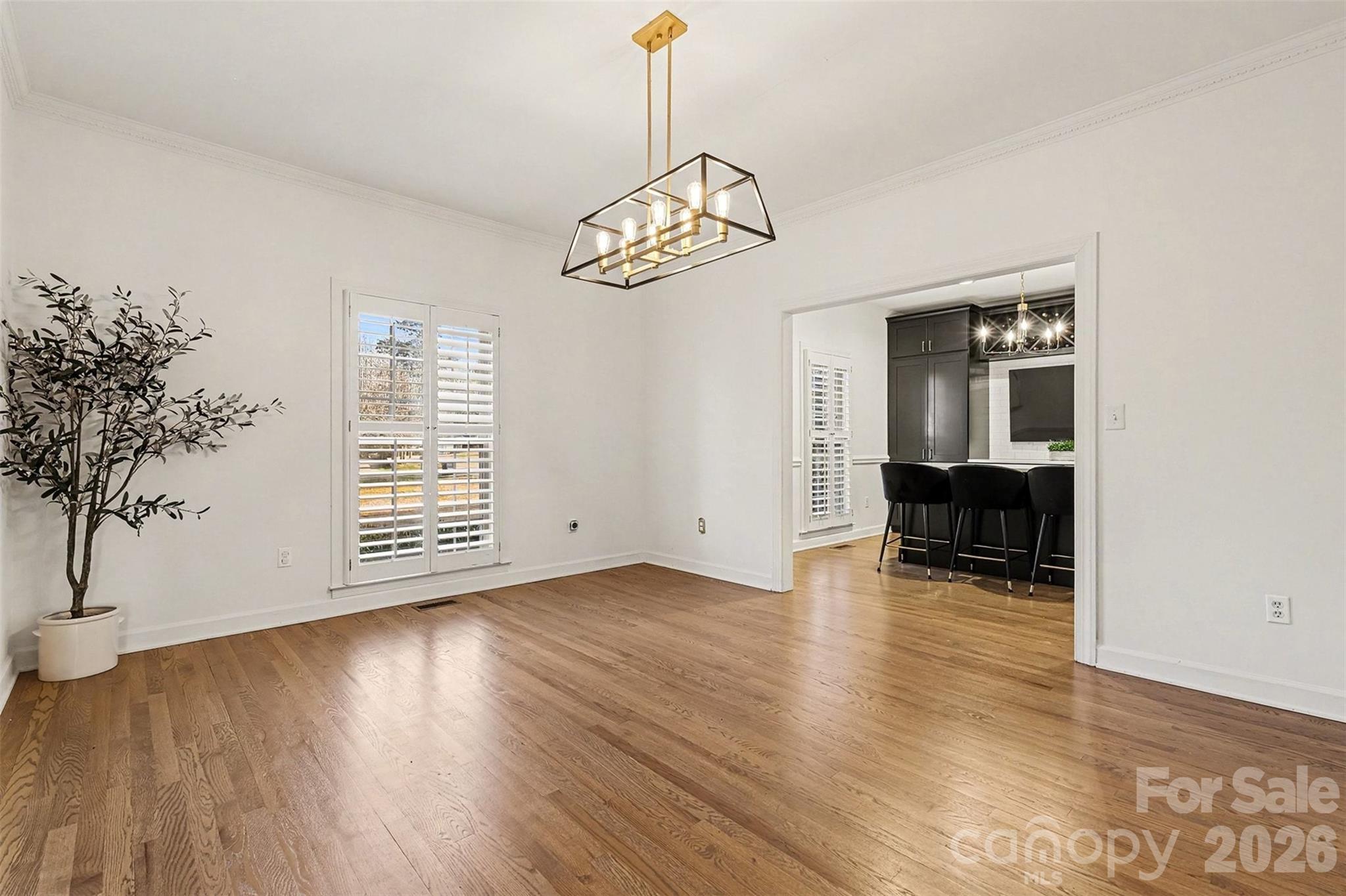 14320 Youngblood Road Charlotte, NC 28278 - Photo 6 of 41 a view of an empty room with wooden floor and a window