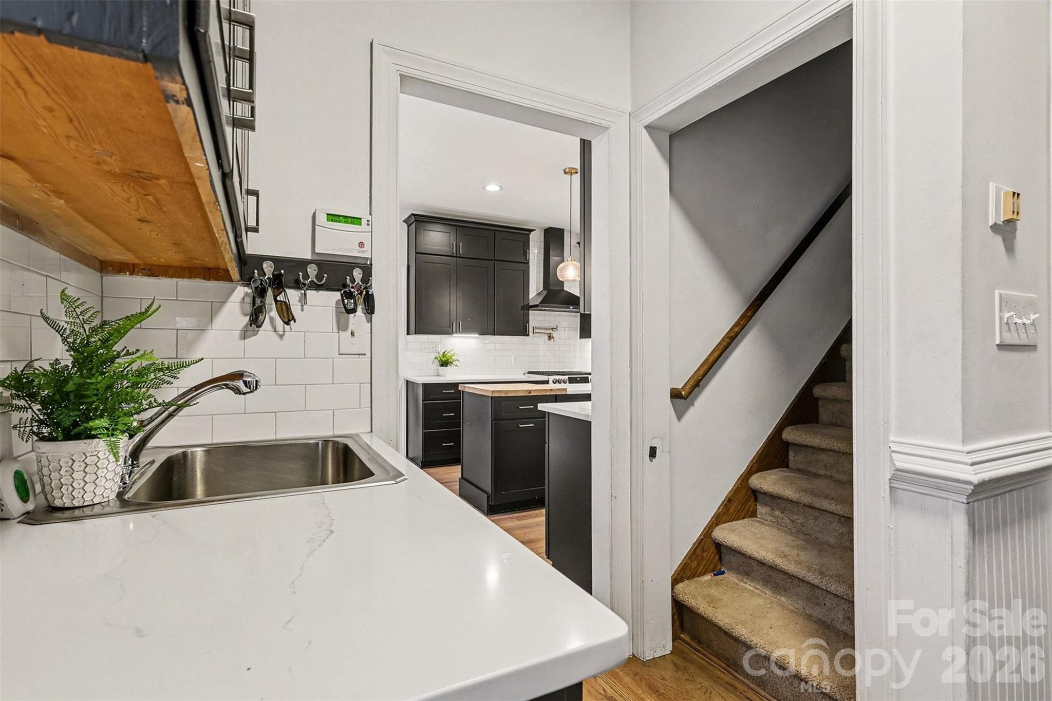 14320 Youngblood Road Charlotte, NC 28278 - Photo 7 of 41 a kitchen with sink a microwave and refrigerator