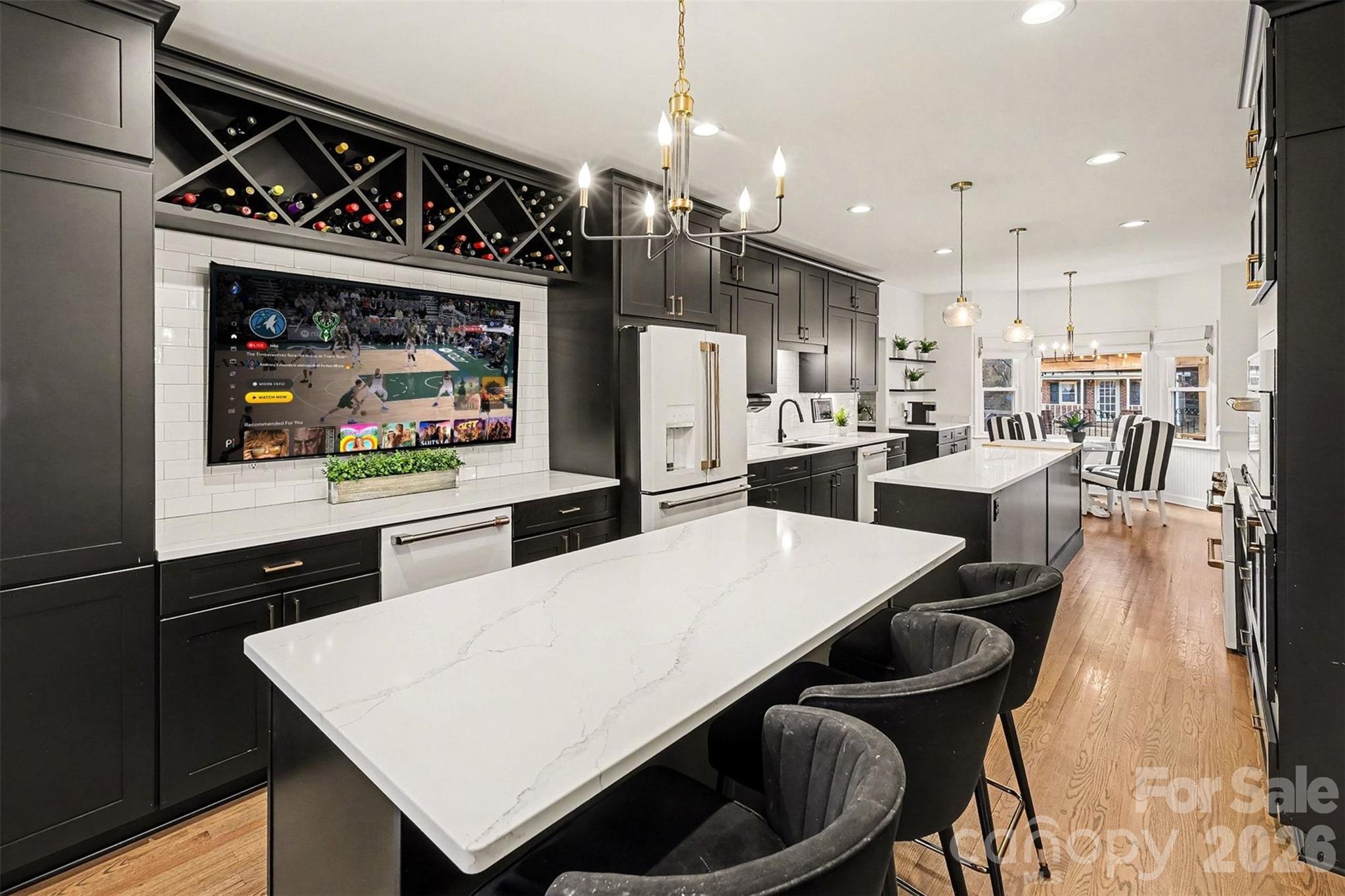 14320 Youngblood Road Charlotte, NC 28278 - Photo 9 of 41 a kitchen with a stove a refrigerator and a dining table