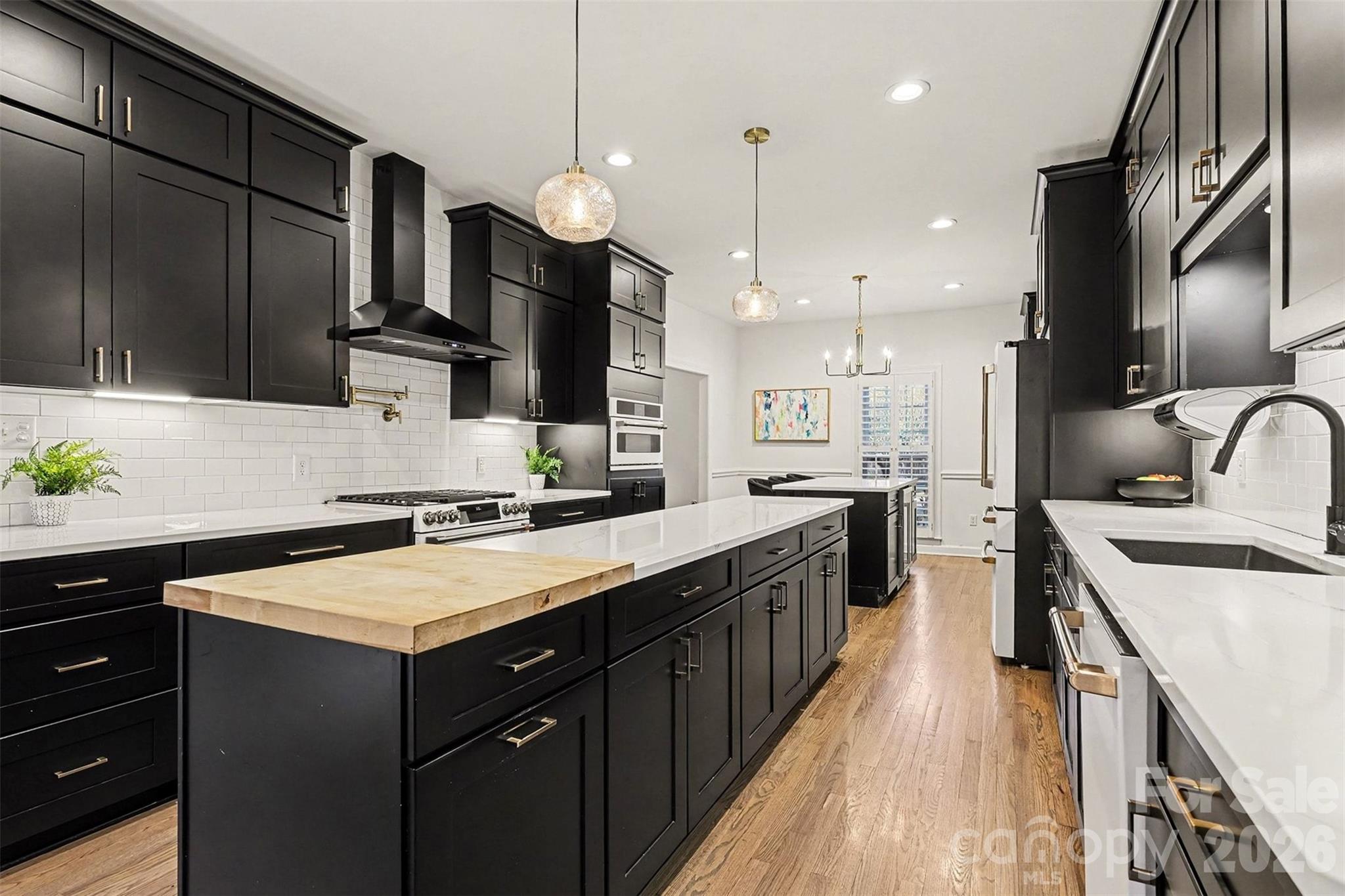 14320 Youngblood Road Charlotte, NC 28278 - Photo 10 of 41 a kitchen with a sink stove and refrigerator