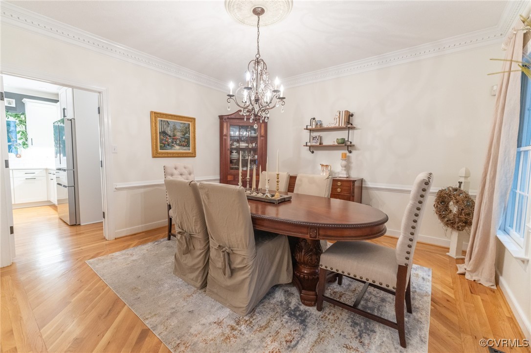 5810 Fox Briar Road Midlothian, VA 23112 - Photo 24 of 50 a view of a dining room with furniture and wooden floor