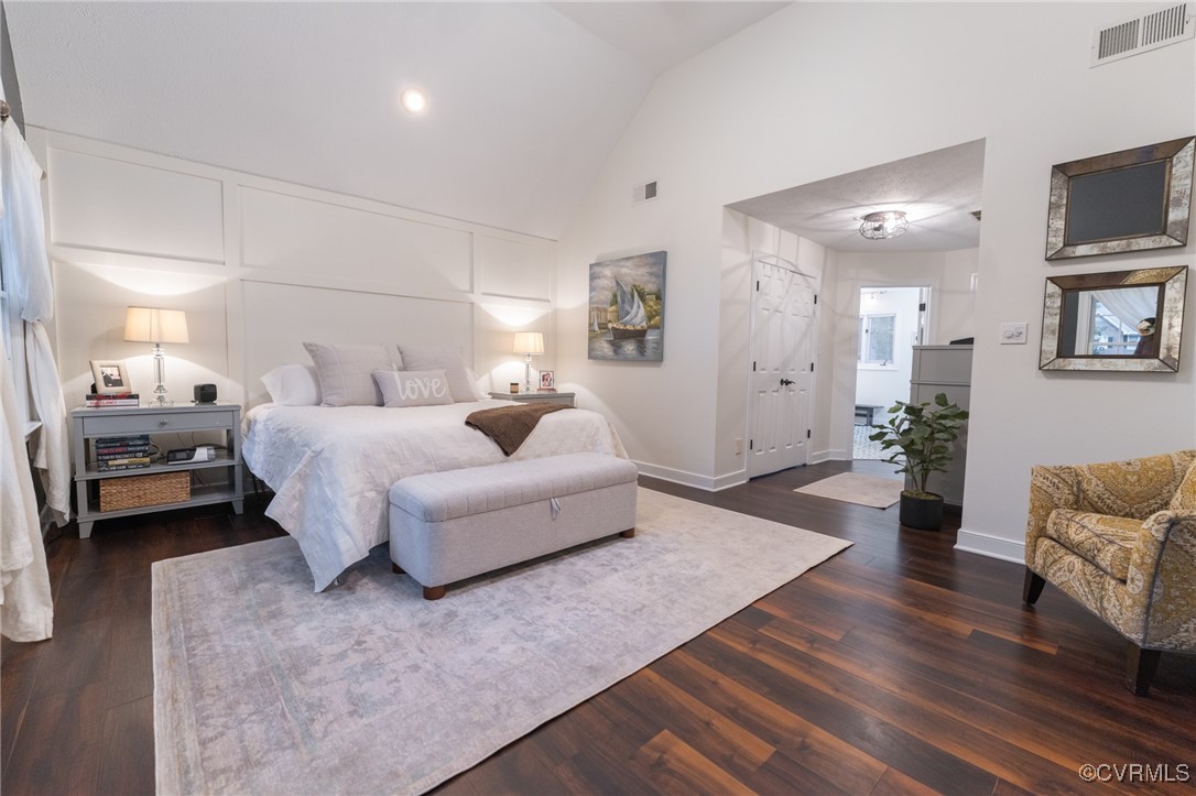 5810 Fox Briar Road Midlothian, VA 23112 - Photo 47 of 50 a spacious bedroom with a bed a couch and a flat screen tv