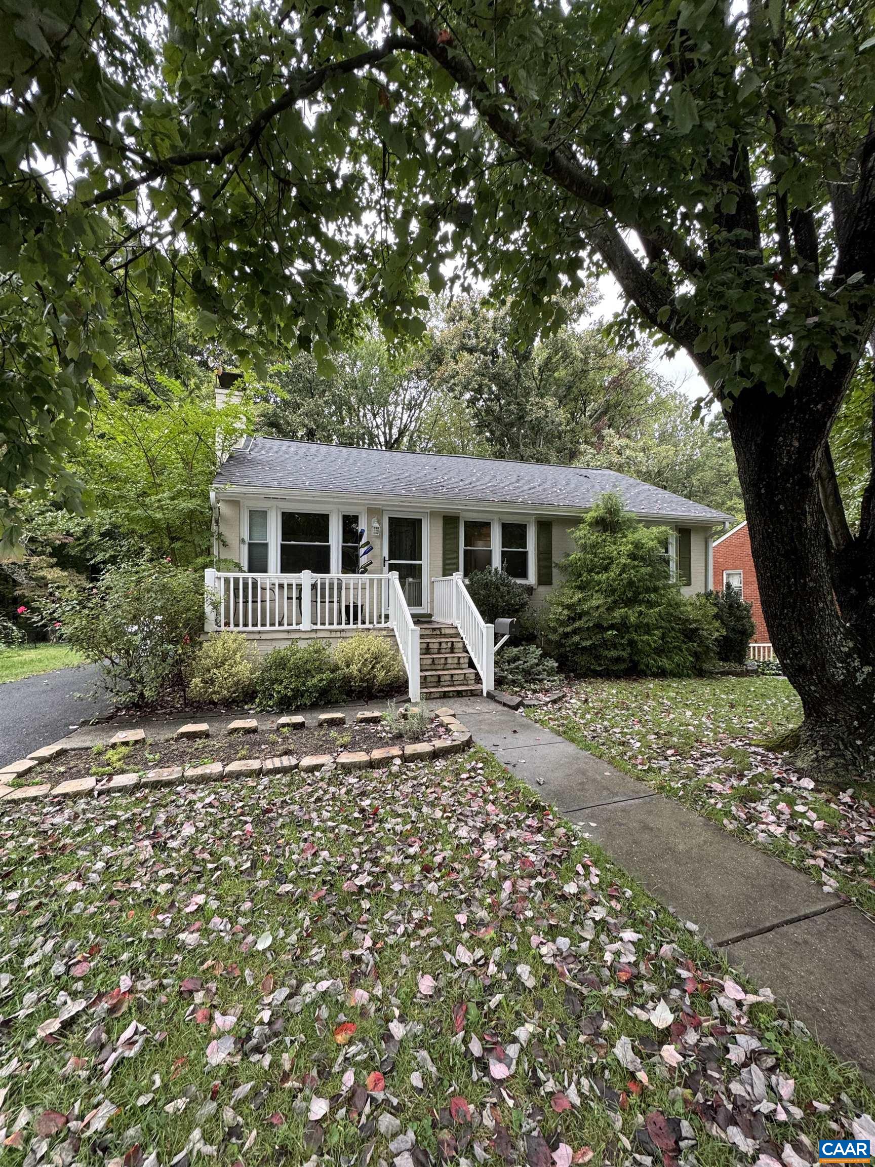 221 Azalea Drive Charlottesville, VA 22903 - Photo 1 of 16 a house with trees in the background