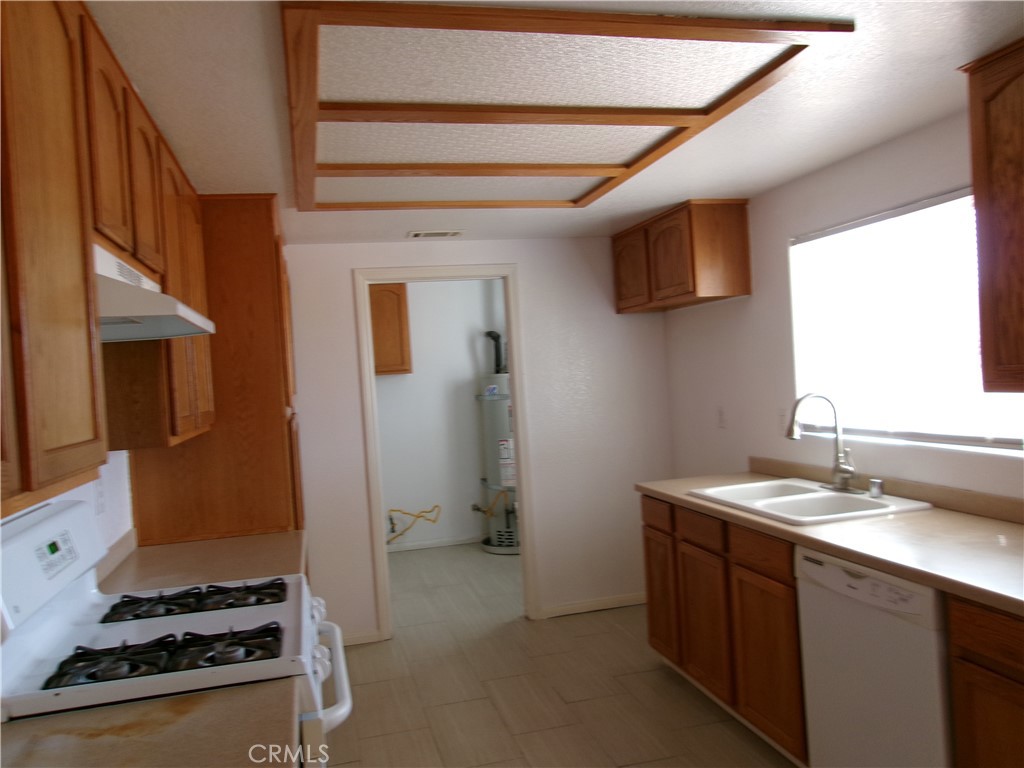 14936 Central Road Apple Valley, CA 92307 - Photo 11 of 33 a room with storage and utility