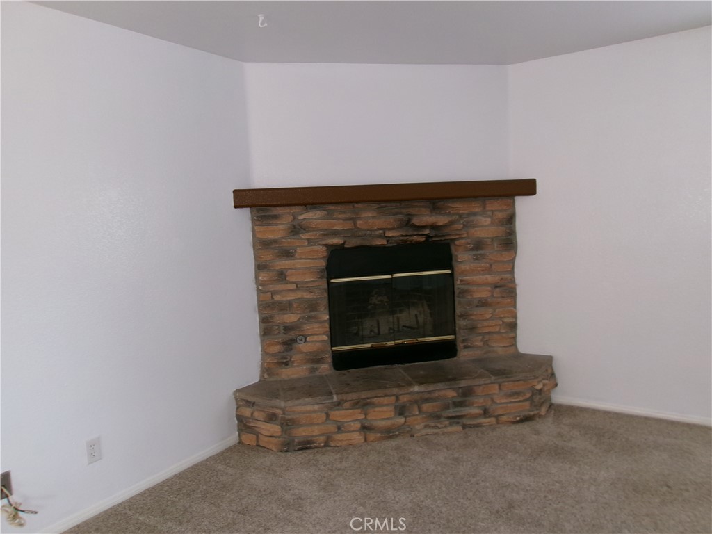 14936 Central Road Apple Valley, CA 92307 - Photo 18 of 33 a room with a fireplace