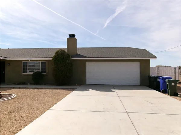 a front view of a house with a garage