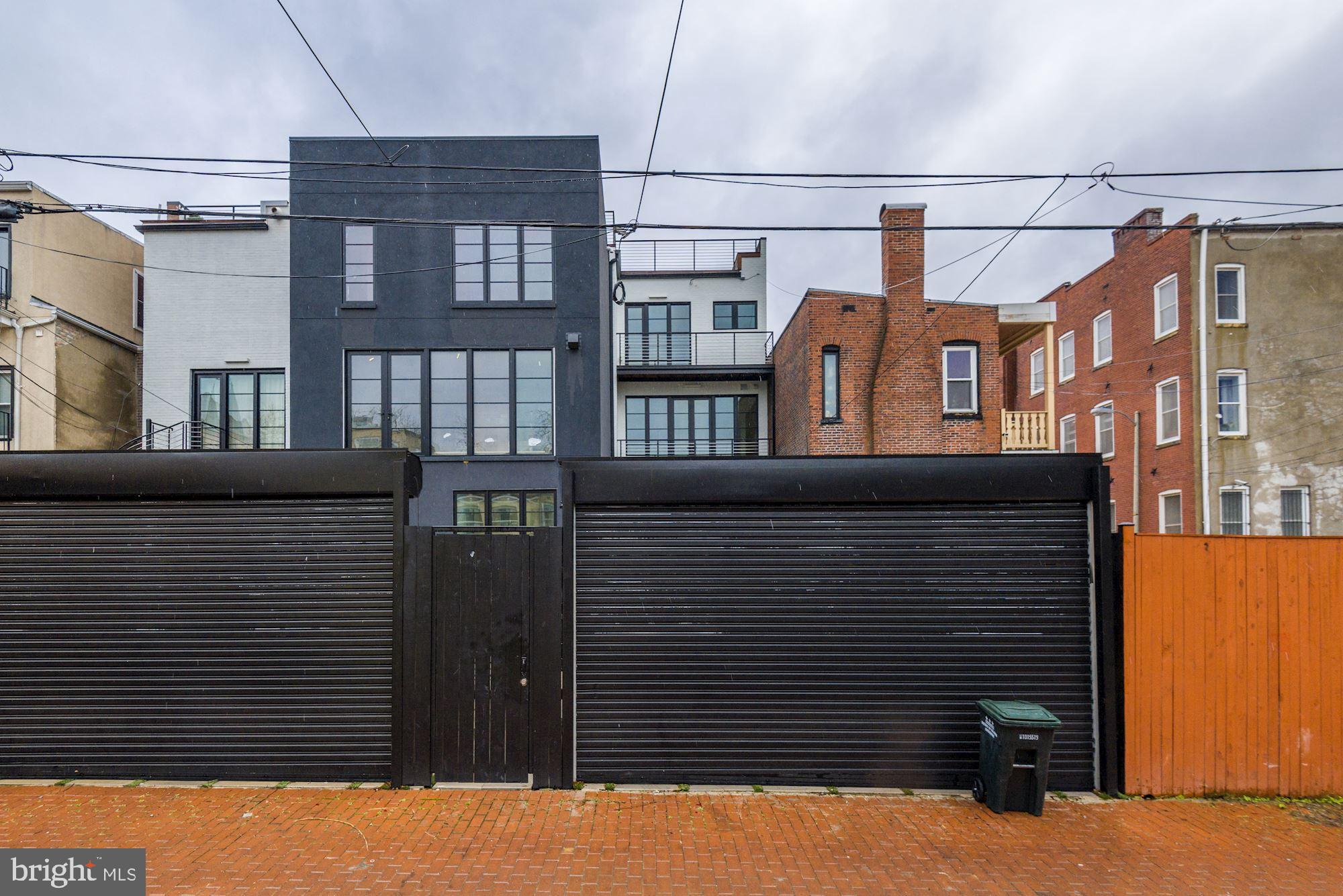 1313 R Street Northwest, Unit 1 Washington, DC 20009 - Photo 32 of 36 Garage doors provide secure parking