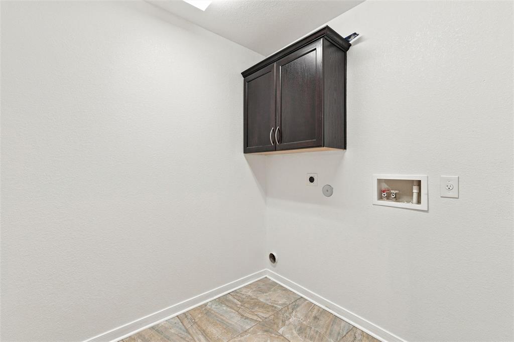 10409 Condor Loop Waco, TX 76708 - Photo 16 of 26 Utility room featuring dark cabinetry with dual handles, wood-finish flooring, neutral wall finishes, and recessed ceiling lighting