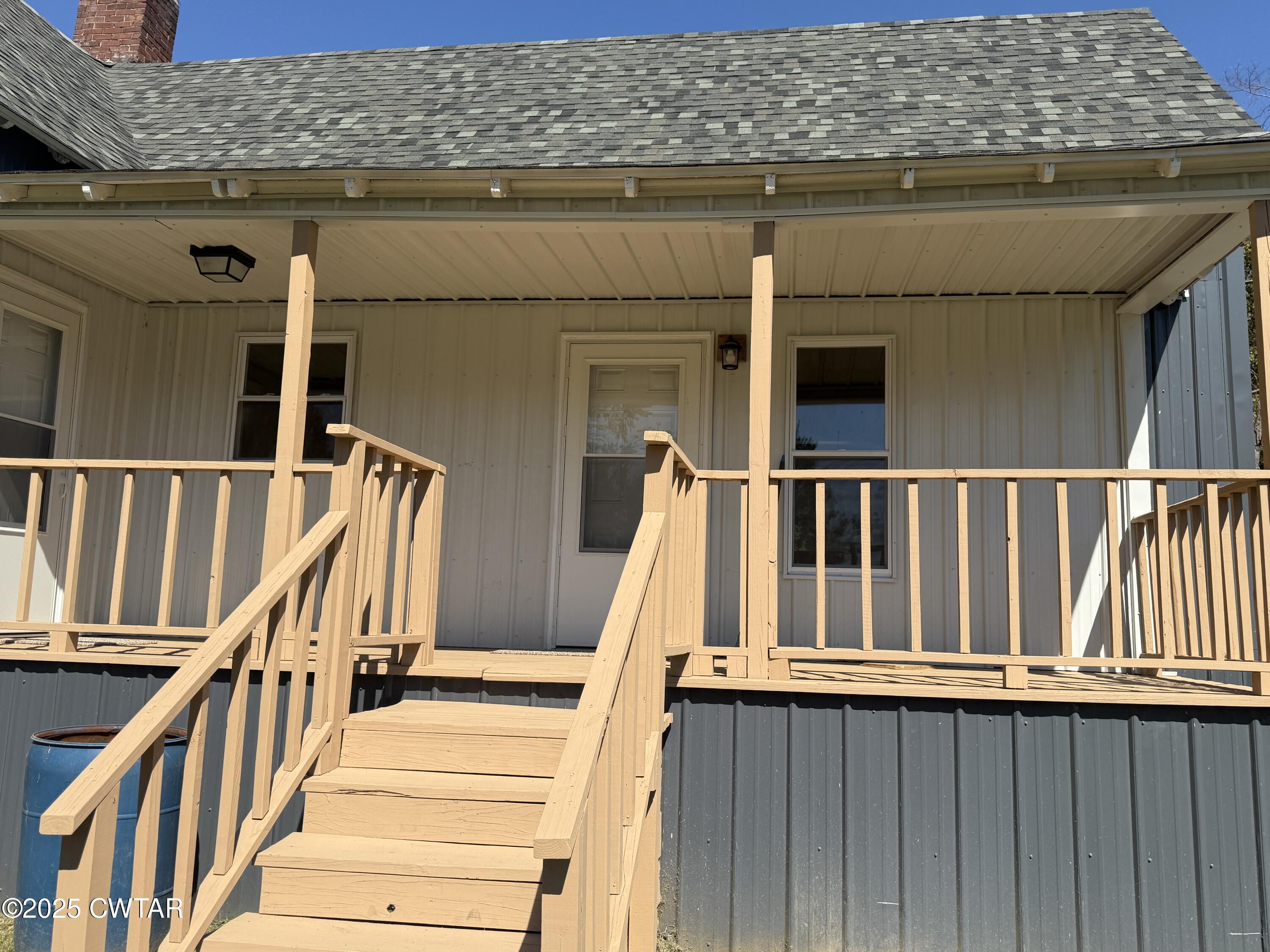 609 West Westbrook St Extension Troy, TN 38260 - Photo 15 of 16 a view of wooden balcony