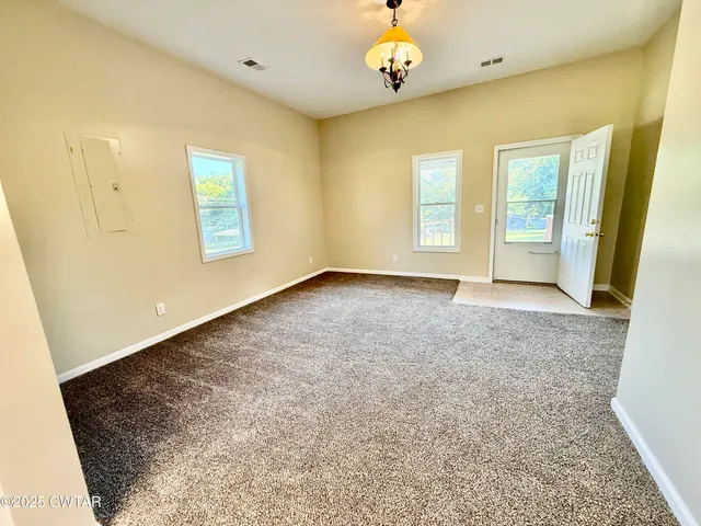 a view of an empty room with a window