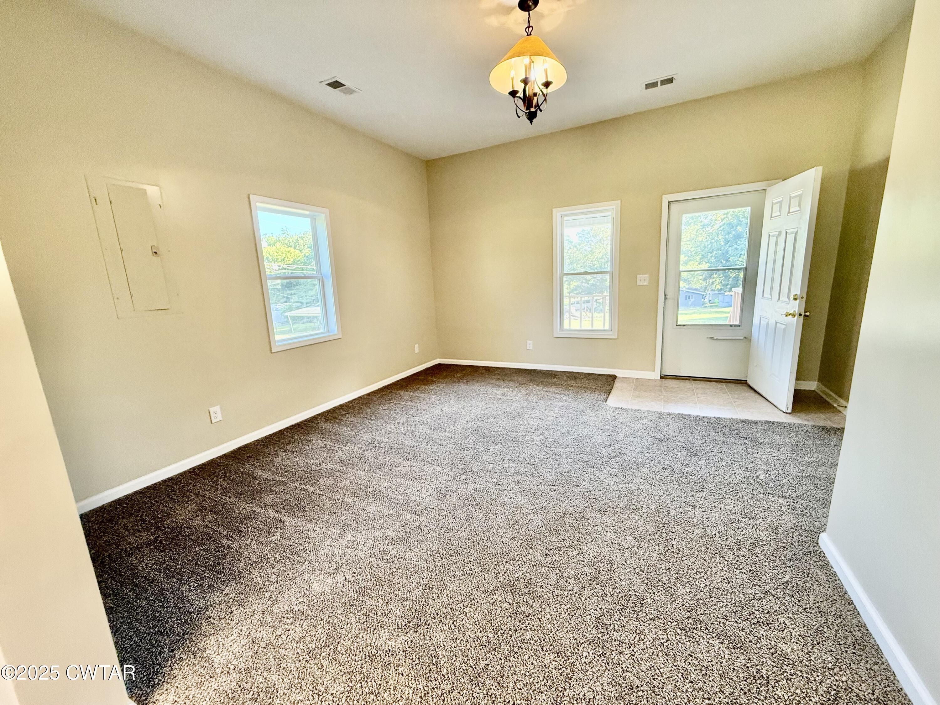 609 West Westbrook St Extension Troy, TN 38260 - Photo 2 of 16 a view of an empty room with a window