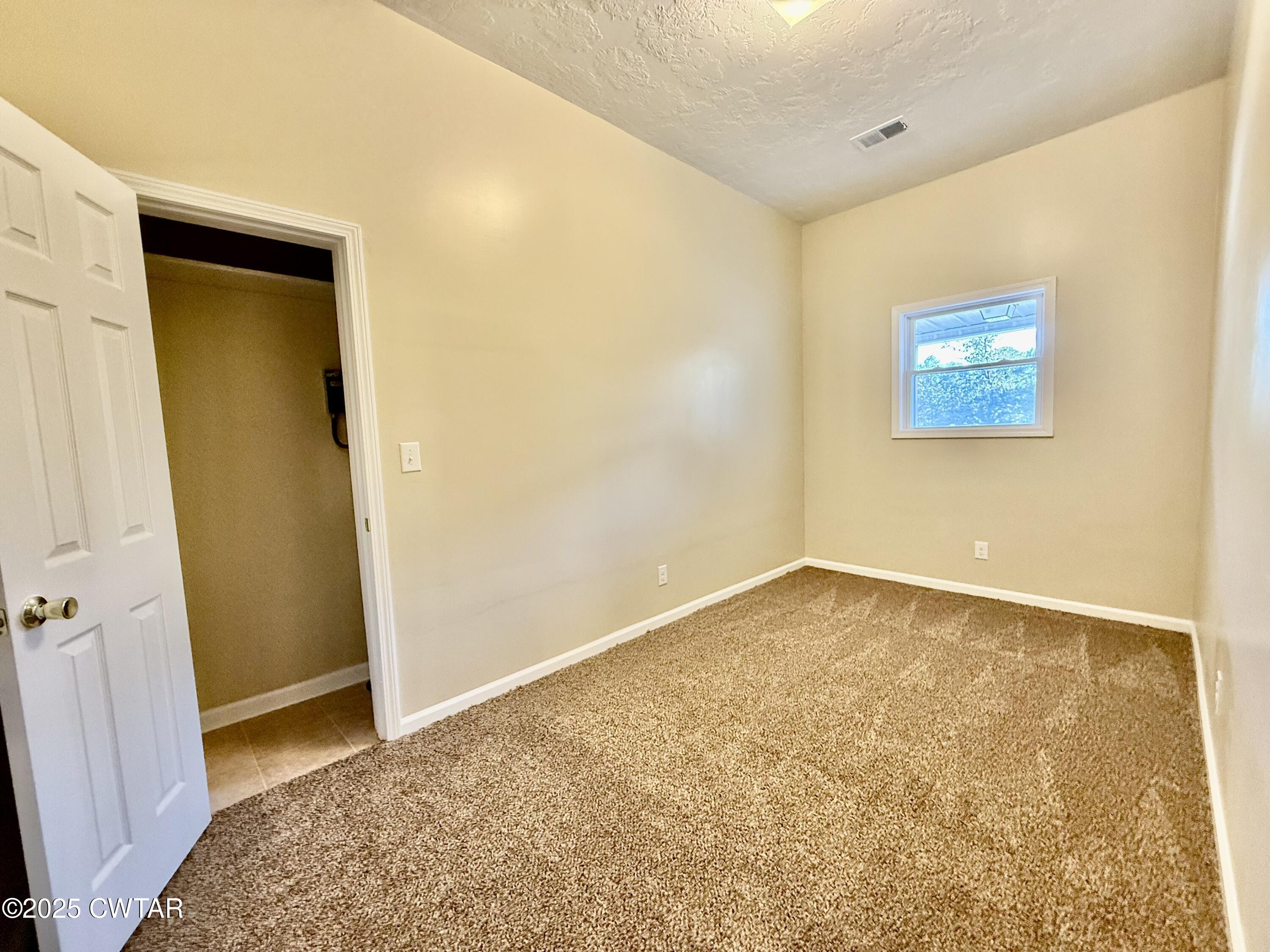 609 West Westbrook St Extension Troy, TN 38260 - Photo 9 of 16 a view of an empty room