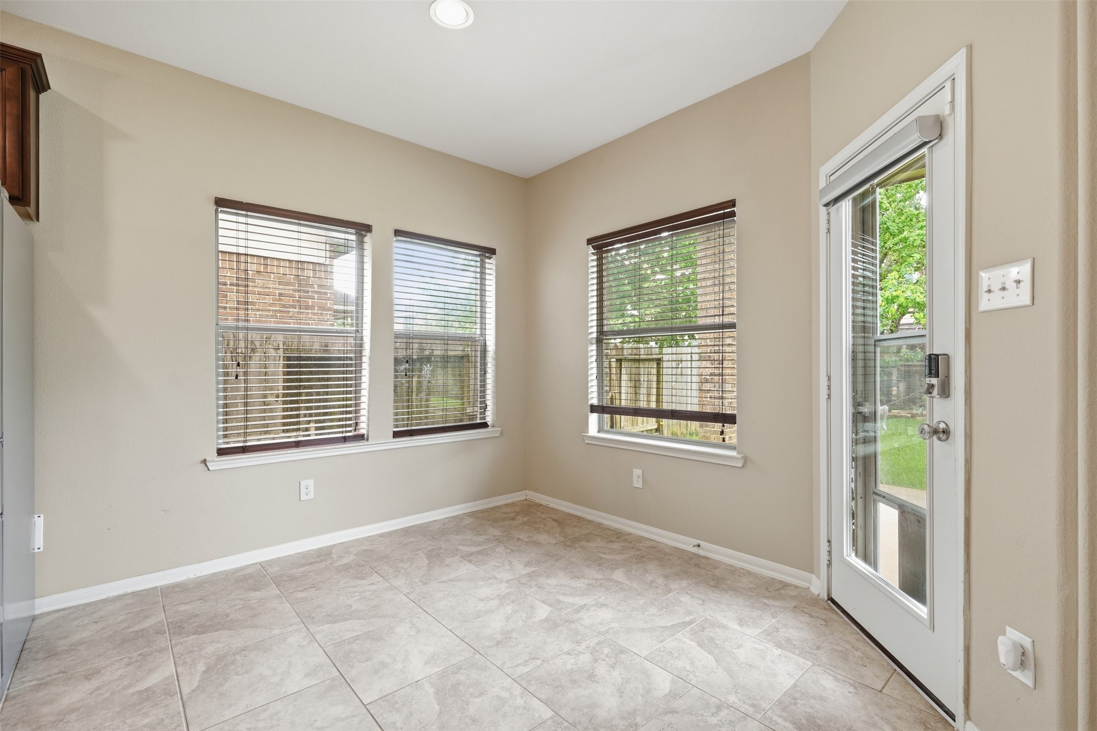 12410 Adams Ridge Lane Humble, TX 77346 - Photo 15 of 33 Sunny breakfast nook looks out to the backyard.