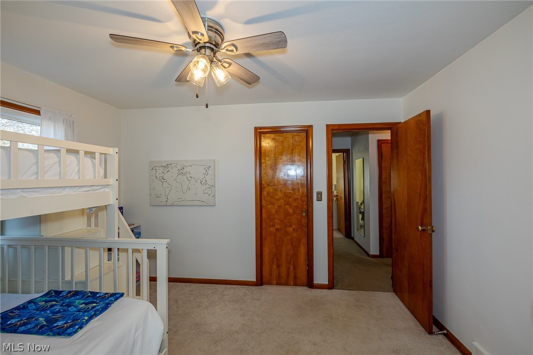180 South Leavitt Road Amherst, OH 44001 - Photo 22 of 37 Bedroom featuring light colored carpet and a ceiling fan