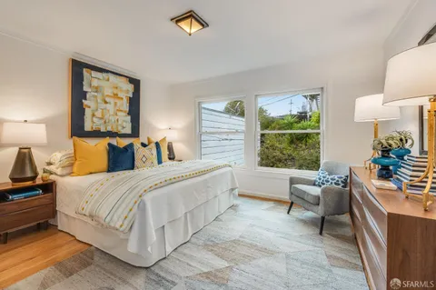 a bed room with a bed and a couch