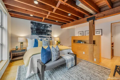 a bed room with a bed and a couch