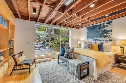 a outdoor living space with furniture and a fireplace