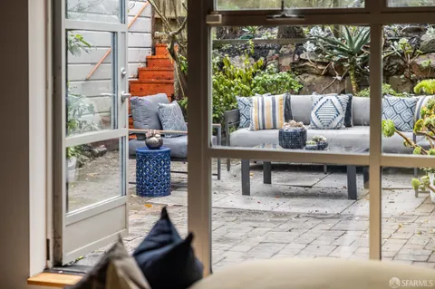 a living room with couch and a window