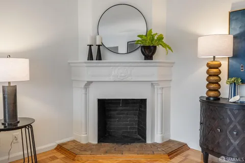 a bedroom with a bed and a fireplace