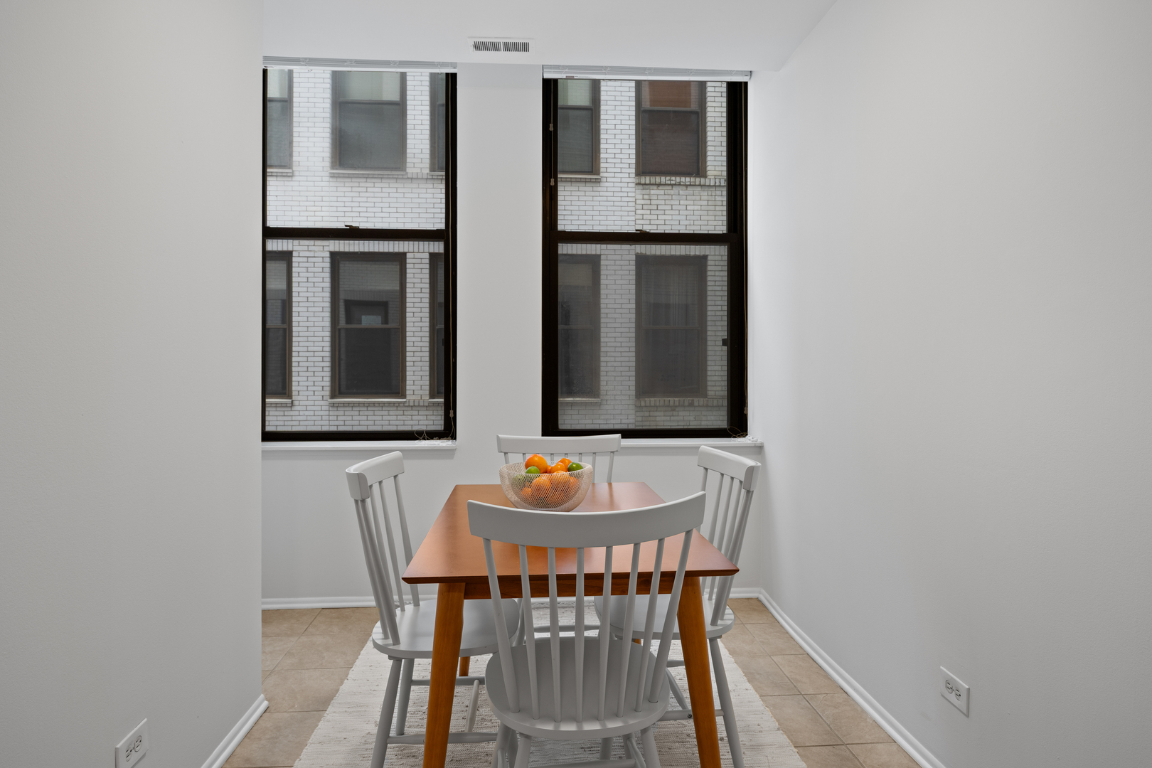 740 South Federal Street, Unit 710 Chicago, IL 60605 - Photo 12 of 23 a view of a dining room with furniture and wooden floor